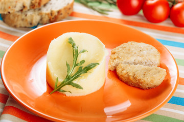 Mashed Potato Chicken Cutlet in Orange Plate. Creamy Mash Food Serving in Restaurant Close-up. Spring Healthy Dinner Meal Homemade