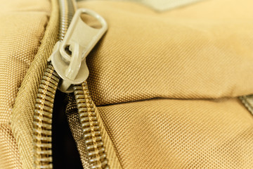 zipper bag color khaki texture. © angintaravichian