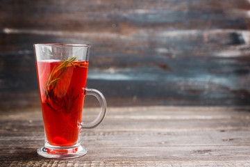 Hot raspberry beverage with rosemary. Selective focus. Shallow depth of field. 