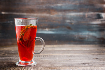 Hot raspberry beverage with rosemary. Selective focus. Shallow depth of field. 