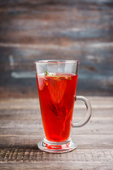 Hot raspberry beverage with rosemary. Selective focus. Shallow depth of field. 