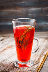 Hot raspberry beverage with rosemary. Selective focus. Shallow depth of field. 
