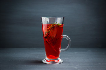 Hot raspberry beverage with rosemary. Selective focus. Shallow depth of field. 