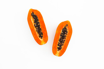 Slices of tasty papaya on white background. Flat lay. Top view.