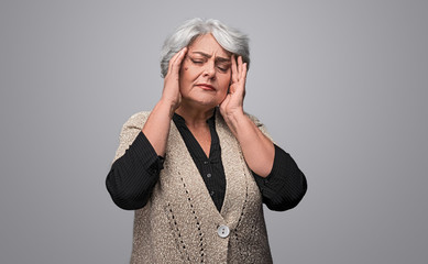 Elderly lady having heavy migraine