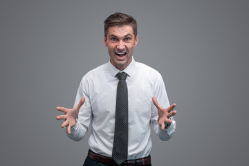 Angry businessman gesturing with hands