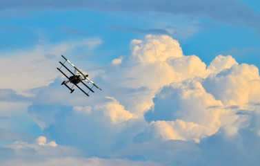 Old triplane fighter flying