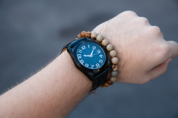 closeup luxury watch on wrist of man