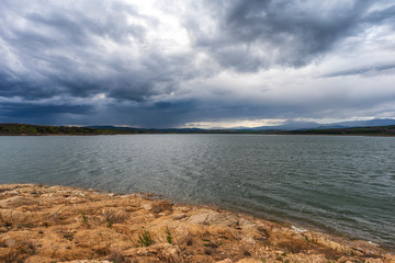 Lake with storm rainy clouds