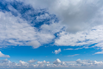 Blue sky with white puffy clouds