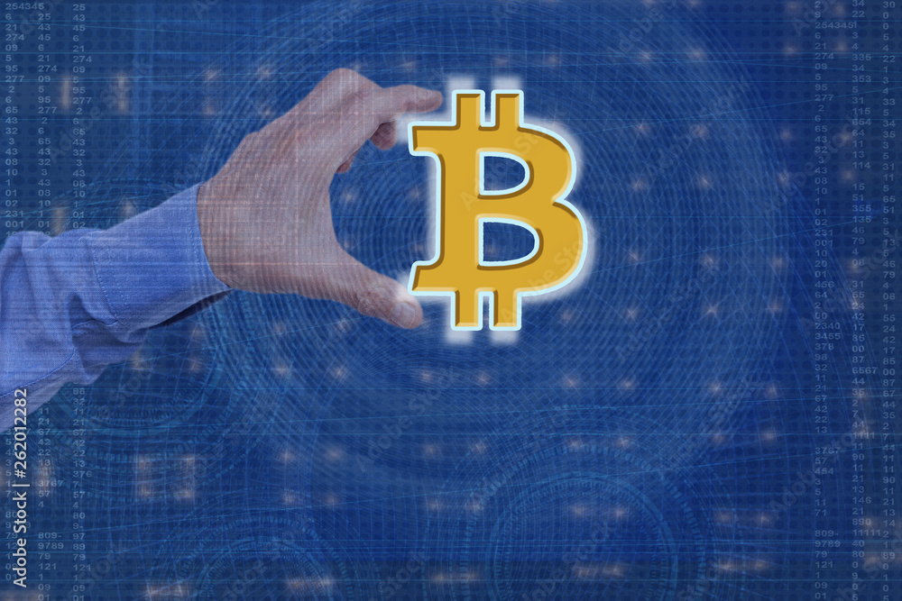 Aufkleber a man's hand using a bitcoin icon on a virtual display, on a technological background, using a netwo