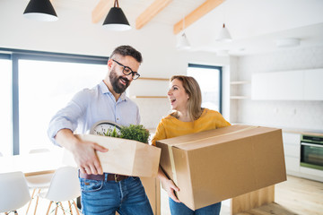 A young couple moving in new home.