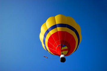 hot air balloon flying with tourists In the clear sky/ winter season. 