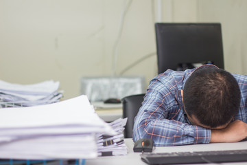 Obraz premium A man working hard burn out syndrome