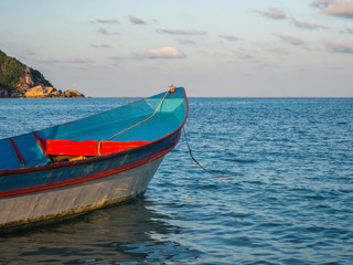 Naklejka premium Motor boat on the surface of the sea near the island. Koh Phangan. Thailand