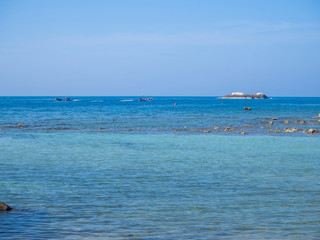 Fototapeta premium Motor boat on the surface of the sea near the island. Koh Phangan. Thailand