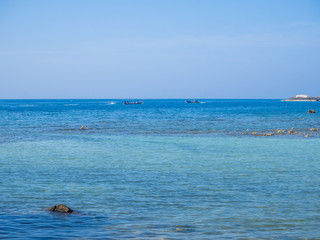 Motor boat on the surface of the sea near the island. Koh Phangan. Thailand