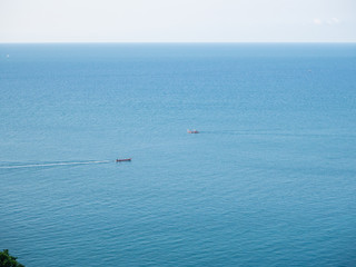 Obraz premium Motor boat on the surface of the sea near the island. Koh Phangan. Thailand