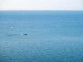 Fototapeta na wymiar Motor boat on the surface of the sea near the island. Koh Phangan. Thailand