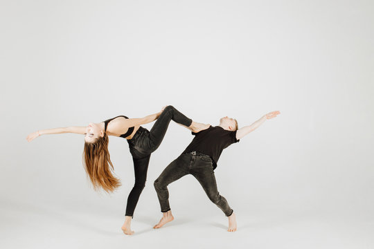 Girl Duet Performing Contemporary Dance On Dark Stage Stock Photo -  Download Image Now - iStock