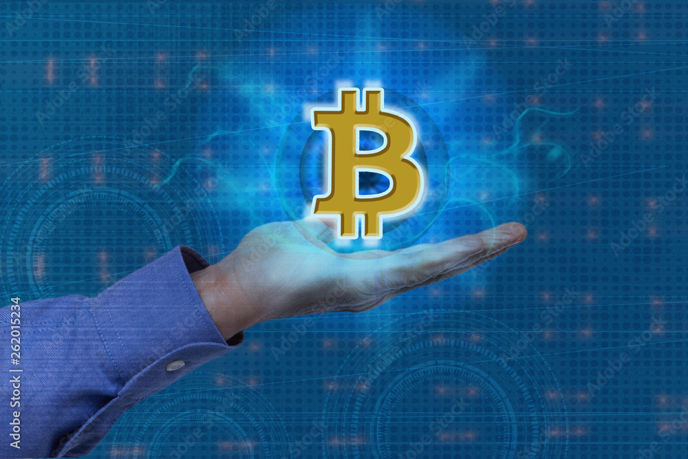 Fototapete a man's hand using a bitcoin icon on a virtual display, on a technological background, using a netwo
