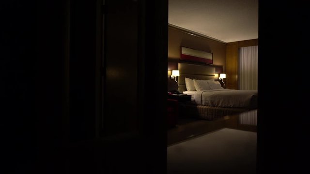 Turning on the lights in a fancy hotel room.