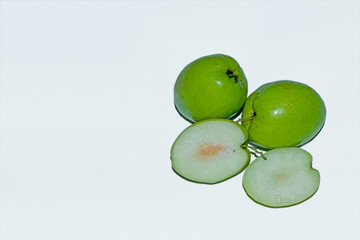 Fresh and sweet Indian green jujube fruit on white isolated background.