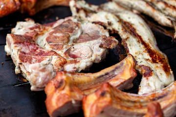 Frying pork meat on grill