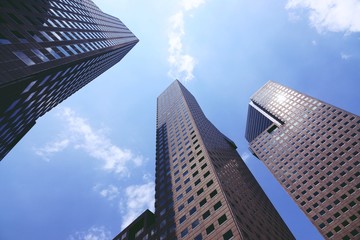 Fototapeta na wymiar Looking up at business buildings at singapore
