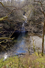 View of a waterfall on a tourist trail in the mountains of Snowdonia, Wales.