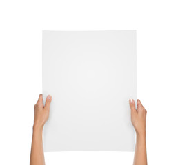 Close up of female hands holding blank paper sheet isolated on white background with copy space