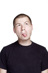 Fototapeta premium Portrait of young man. Facial expression. Face with tongue.