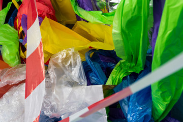 Crumpled and wrinkled colorful plastic bags and material