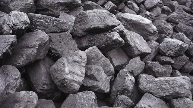 big pieces of coal in a coal warehouse