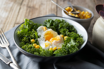 Poached eggs with Kale lettuce and corn salad. Healthy breakfast or dinner. Lose weigh, clean eating.