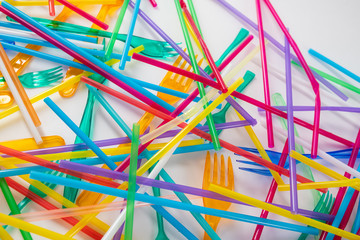 Dangerous and harmful bright straws being thrown on the floor