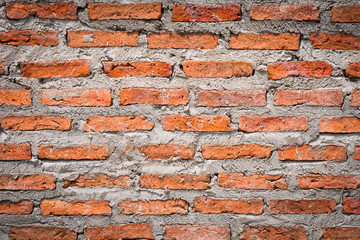 Obraz premium Red brick walls that use cement as fasteners. Popular in construction. Shows the surface and pattern. Suitable to use as a background image and graphic design.