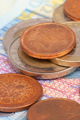 Micro loan offer. Little bit of European Union money. Metal coins of and paper banknotes design. Euro cash closeup on white background. Limited depth of field