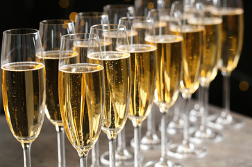 Glasses of champagne on table, closeup. Space for text