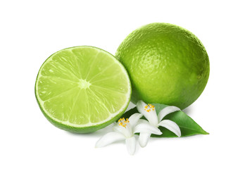 Ripe limes and flowers on white background. Citrus fruit