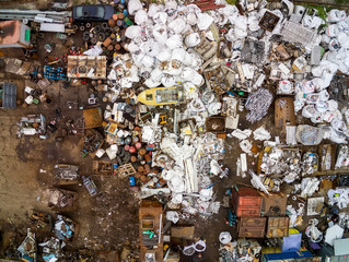 Scrap metal junkyard area aerial view. Reception and storage metal waste before recyclyng