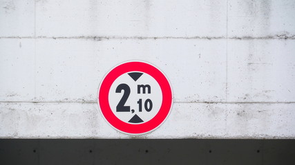 15625_A_red_signage_on_the_white_wall_of_the_parking_lot.jpg