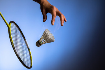 Badminton racket and shuttlecock  in motion closeup
