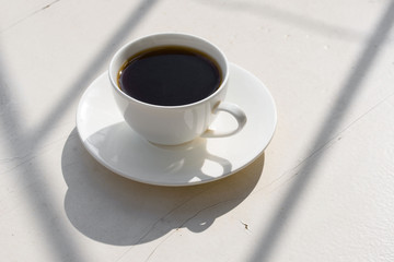 Fragrant coffee in a white cup on the nature.