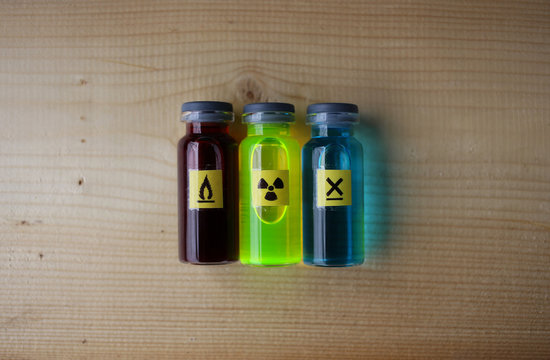 Dangerous liquid colored chemicals.The red liquid is flammable, the green is radioactive, the blue is moderately toxic