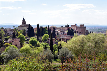 Fototapeta na wymiar View of the bell tower of the Alhambra from the Generalife gardens on a bright summer day in Granada, Spain