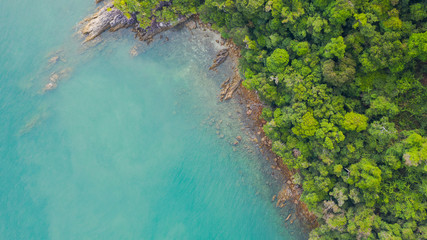 Aerial view photo, Tropical beach with ocean and rock on the island