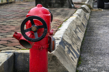 Old red fire hydrant on a city street