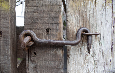 Old lock on the gate. lock on the door of an old rural home. real country style. close-up. focus on...