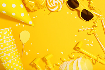 Birthday party decorations on yellow background. Minimalism concept